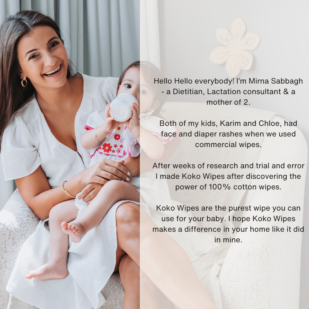 A smiling mother holding her baby on her lap while sharing her story about creating Koko Wipes – 100% Dry Cotton Wipes, inspired by her children’s sensitive skin.
